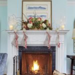 southern-living-christmas-stockings-fireplace-hurricane-candles