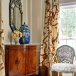 Shelley-Johnstone-interior-design-antique-demi-lune-tables-crewel-curtains-draperies-benjamin-moore-feather-down-4311-Arcady-Ave_living-room-drapes-613×920