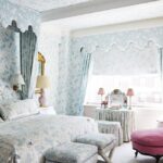 Chiqui-Woolworth-colorful-manhattan-apartment-quadrille-blue-white-bedroom-print-on-print-matching-linens-curtains-pink-accents-old-school-dressing-table-skirted