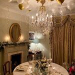 new-years-even-dinner-party-silver-gold-tablescape-balloons-elegant-glamorous-crystal-chandelier