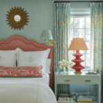 barrie-benson-classic-bedroom-monogrammed-linens-sunburst-mirror-above-bed-chintz-curtains