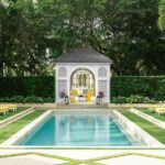 McKinnon & Harris pool house treillage yellow chaise palm trees