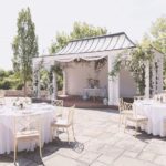 emily-hertz-born-on-fifth-pool-house-climbing-pink-roses-trellis-swags