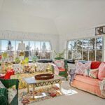 john-travolta-kelly-preston-islesboro-maine-house-for-sale-chintz-sun-room-garden-wicker