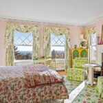john-travolta-kelly-preston-islesboro-maine-house-for-sale-pink-chintz-damask-wallpaper-bedroom