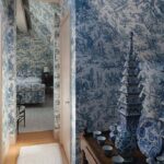 blue-and-white-toile-wallpaper-matching-upholstery-attic-bedroom