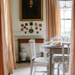 anne-wagoner-interiors-dining-room-traditional-classic-style-antique-oil-painting-framed-gilt-silk-curtains-peach-apricot-blush-crystal-chandelier