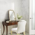cece-barfield-thompson-west-village-new-york-city-apartment-beautiful-marble-bathroom-getting-ready-area-gold-mirror-flowers-the-glam-pad