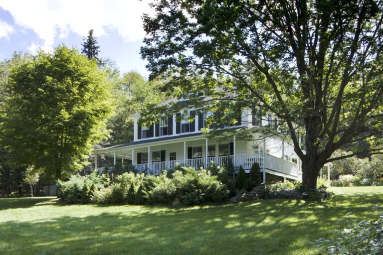 A Charming Cottage Dressed All In Green